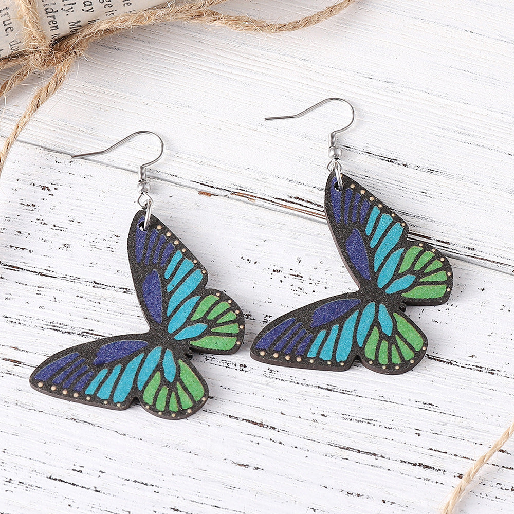 Alas de mariposa al por mayor Pendientes de madera de doble cara